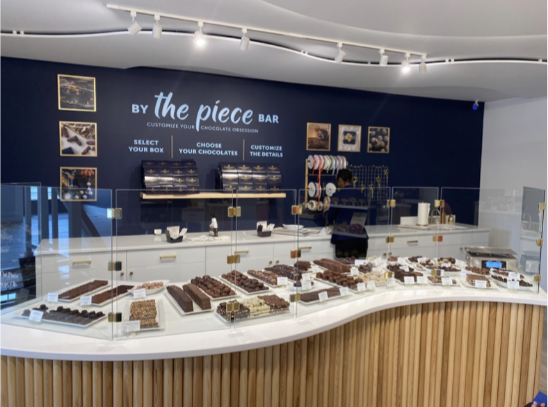 Customers+go+to+the+By+the+piece+bar+to+order+custom+amounts+of+assorted+chocolate.+Bridgewater+offers+a+pound+box%2C+half+a+pound%2C+or+a+bag+that+is+weighed+at+checkout.+
