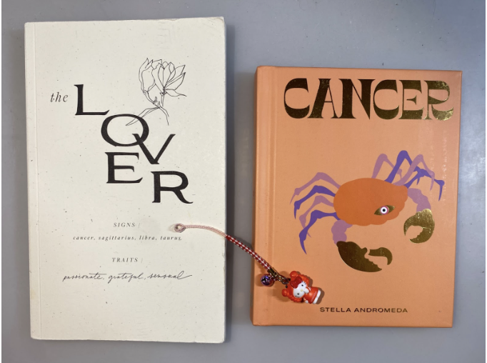 Over+the+years%2C+I%E2%80%99ve+collected+my+fair+share+of+astrology+paraphernalia%2C+including+a+notebook%2C+an+informational+book+about+Cancers+and+a+Hello+Kitty+keychain+dressed+as+a+crab.