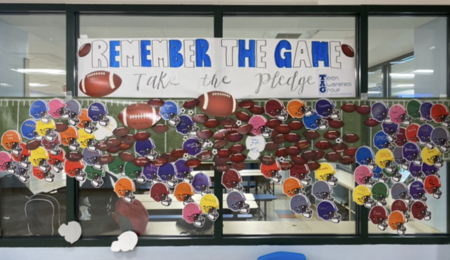 Students pledged to “remember the game,” TAG’s campaign organized to limit underage drinking. Footballs and football helmets were hung outside the cafeteria with student names as they pledged during the week leading up to the homecoming game. 