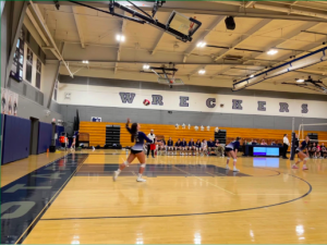 Morgan Carnahan ’23 serves the ball giving the Wreckers another point 