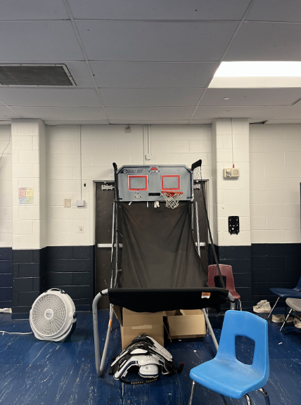 Staples boys’ football locker room contains a mini basketball hoop game.