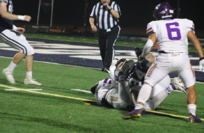 A Staples player tackles a West Hill player five yards from the end zone. This tackle stopped West Hill from scoring a single point.
