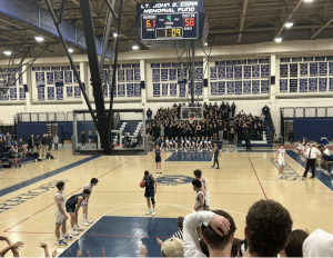 Charlie Honig ’23 shoots two at the free throw line with just over a minute left in regulation time (Photo by William Murray 25)