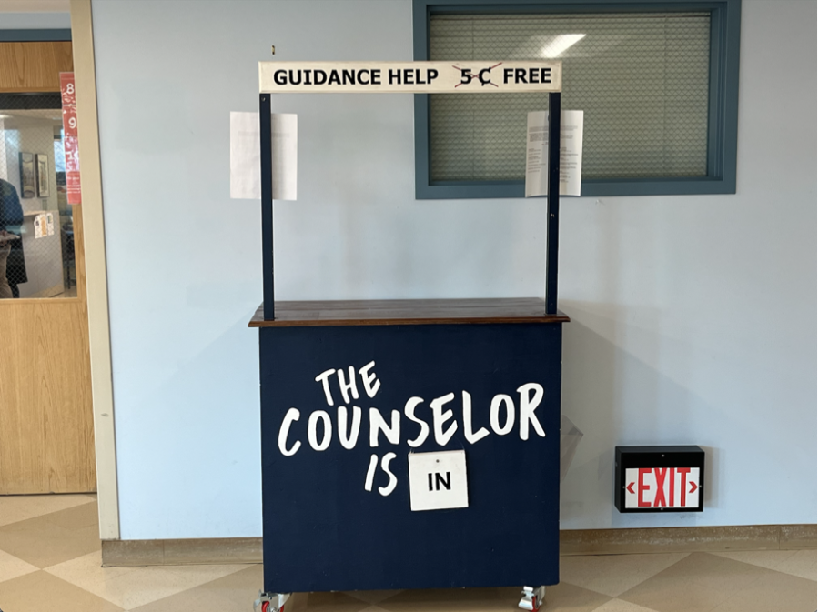 This stand stays outside of the school counseling offices and is a place where students can interact with a school counseling officer during the school day.  Even though this sign states, “Guidance help: free” they would like their services to be called “School Counseling.”
Photo by Aidan Sprouls 23.