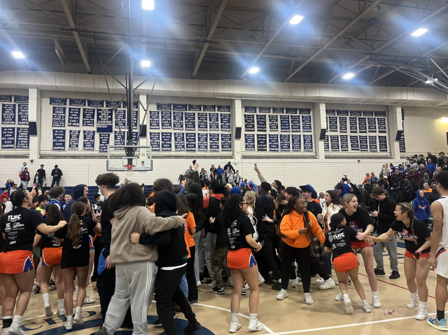 After the game, the Danbury student section rushed the court to celebrate the FCIAC win.