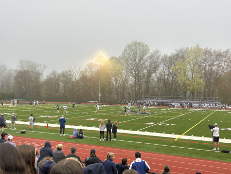Students and parents fill up the bleachers, showing their support for the Staples boys’ lacrosse team against Darien.