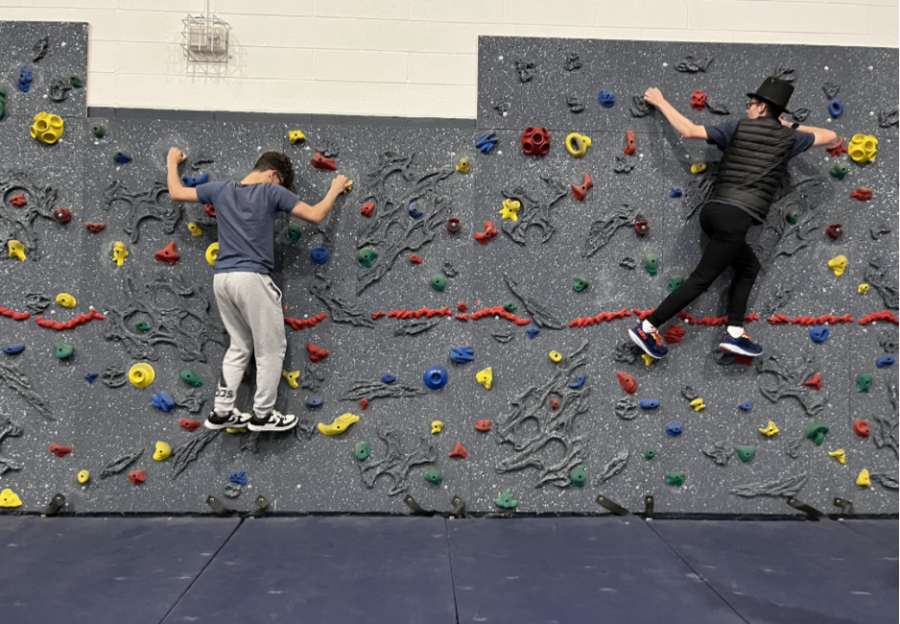 Students+record+each+other+climbing+the+rock+wall+and+using+certain+skills+in+order+to+receive+full+credit.+