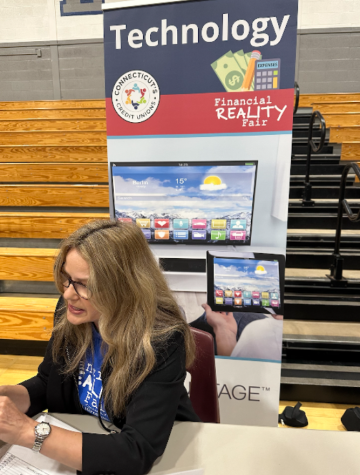 Students attended a variety of stations at the Financial Reality Fair. After students had bought their necessary purchases, they conferenced with an adult about how the process went and reflected on how this translates to the real world.