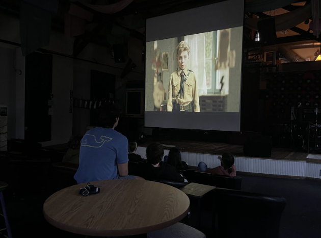 Members of the film club, along with other high schoolers, watch “Jojo Rabbit,” a satirical film about a young German boy and his imaginary friend, a cartoonish version of Adolf Hitler, during WW2. 
