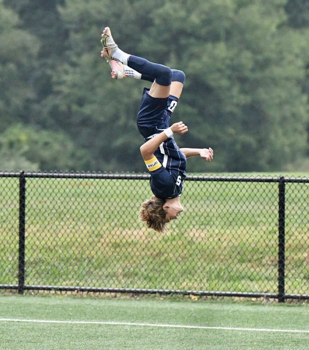 Avery Mueller ’24 celebrates his first goal with a back flip.