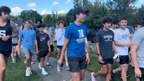 The Wreckers boys’ track team enters the Ridgefield cross country course, consisting of two loops of a gravel course surrounding its athletic complex, plus a series of switchbacks on the main green.