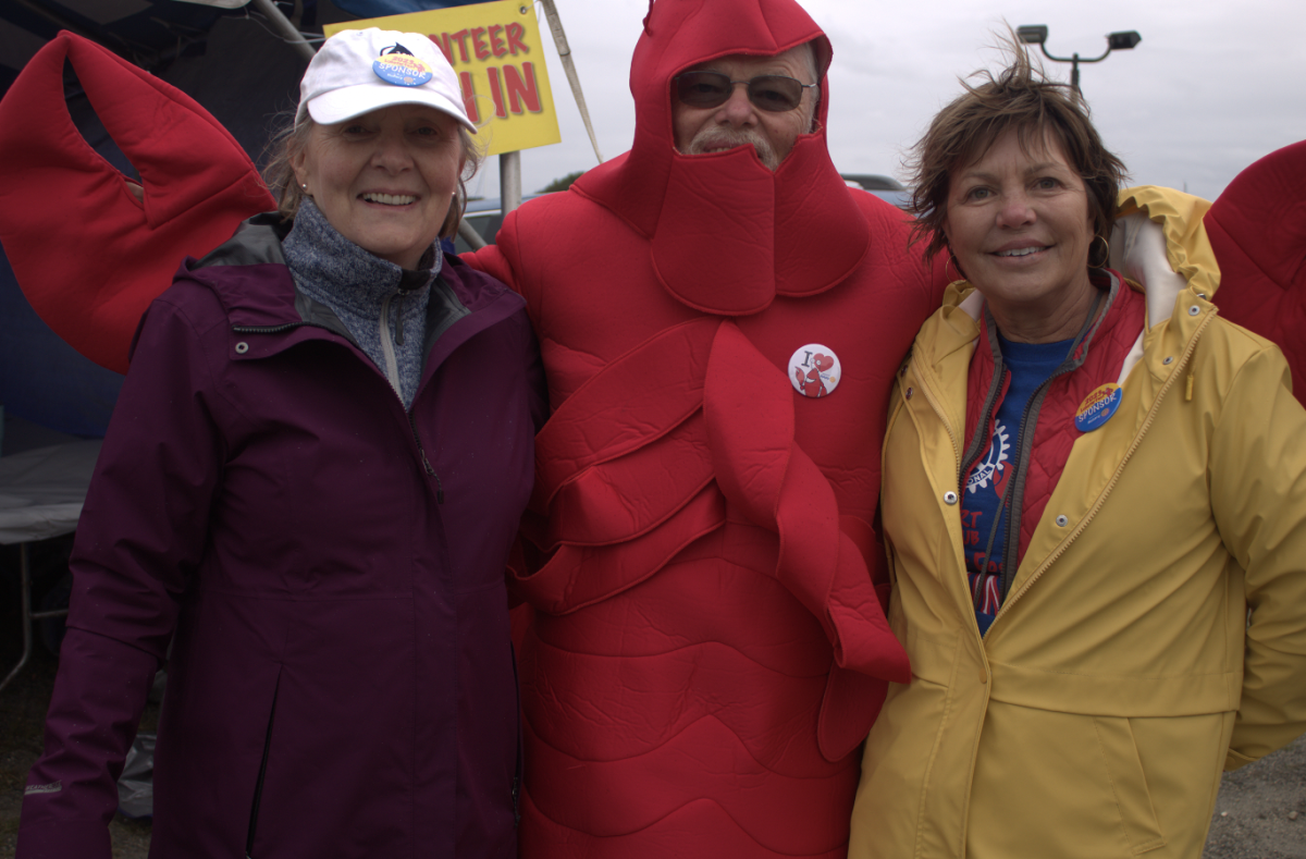 A+grinning+Rick+Benson+proudly+sports+the+costume+for+the+iconic+mascot+of+Lobster+Fest%2C+ready+to+brave+the+steadily+incoming+storm+alongside+all+the+courageous+volunteers+stationed+across+the+area.%0A