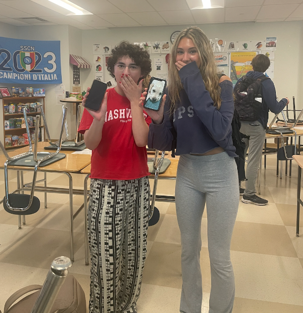 Eva Glennon ’24 and Jona Bernstein ’25 take a brief break in Italian class as phone alarms went off from the National Wireless Emergency Alert System. 
Photo dramatization by Ella Harrington ’25.