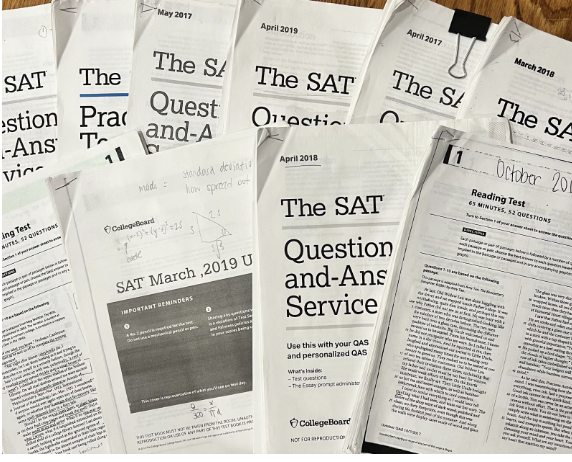 10 SAT tests that were printed out to help with studying. Each full test above takes 3 hours to complete, so taking each of these 10 tests would amount to 30 hours of studying. 

