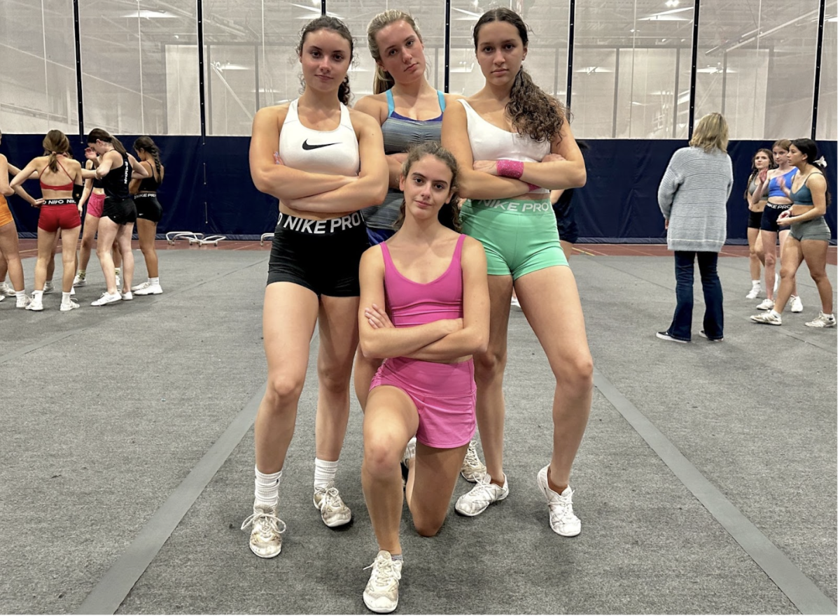 The Staples Varsity Cheerleading top stunt group gets ready for tryouts. 