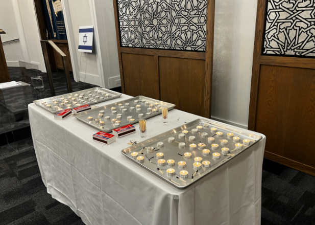  At the Chabad shabbat ceremony, these candles were lit in memorial for the lives lost in Israel, and stayed lit for the duration of the service. 
