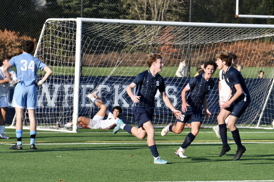 Cormac Mulvey ’25 (left) celebrates his equalizing goal with Adam Syah ’24 (middle) and Sam Rossoni ’25 (right).