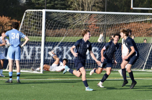 Cormac Mulvey ’25 (left) celebrates his equalizing goal with Adam Syah ’24 (middle) and Sam Rossoni ’25 (right). (Contributed by Avery Mueller ’24)
