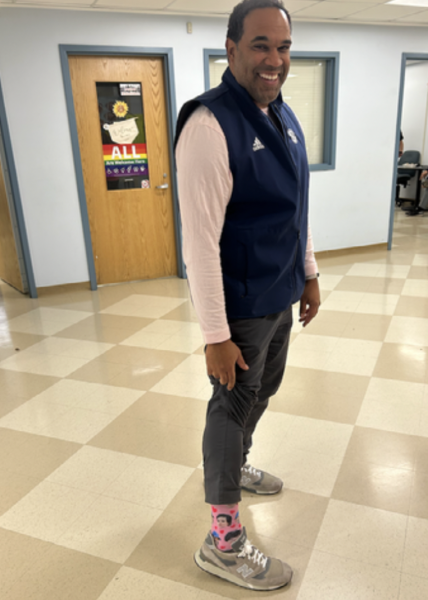 Principal Stafford W. Thomas Jr. carries spirit week on his back by wearing pink for color wars in the week leading up to homecoming. 