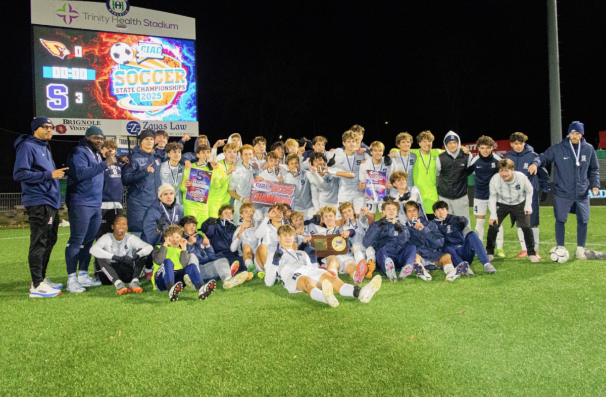 Staples boys’ soccer celebrates after winning their 28th State Championship.