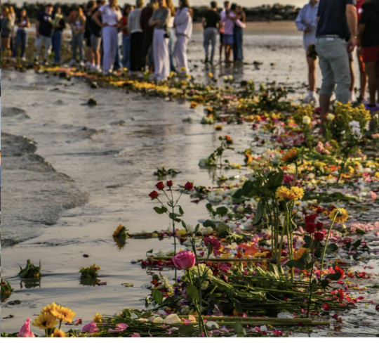 At the memorial at Compo beach friends, family, teachers, and towns people left flowers by the water. 