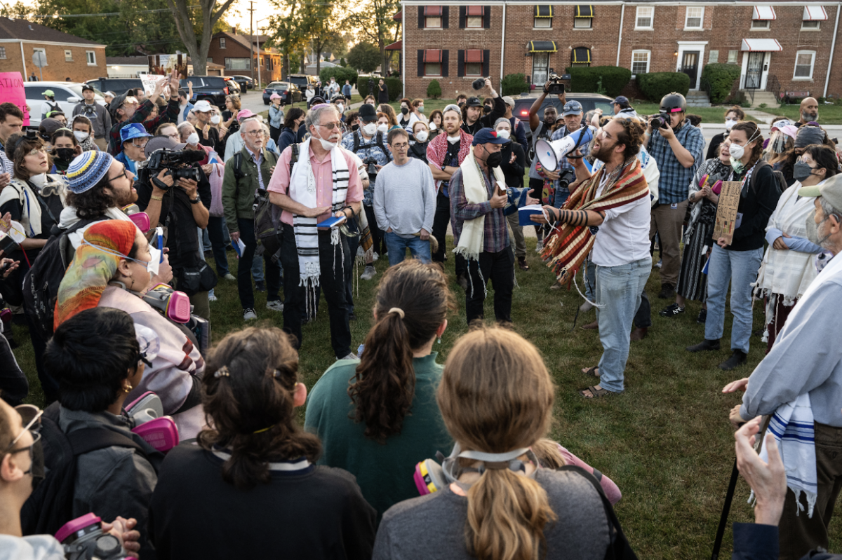 A crowd gathers outside the Broadview ICE facility to call for an end to deportations during a “No More Deportations” protest.