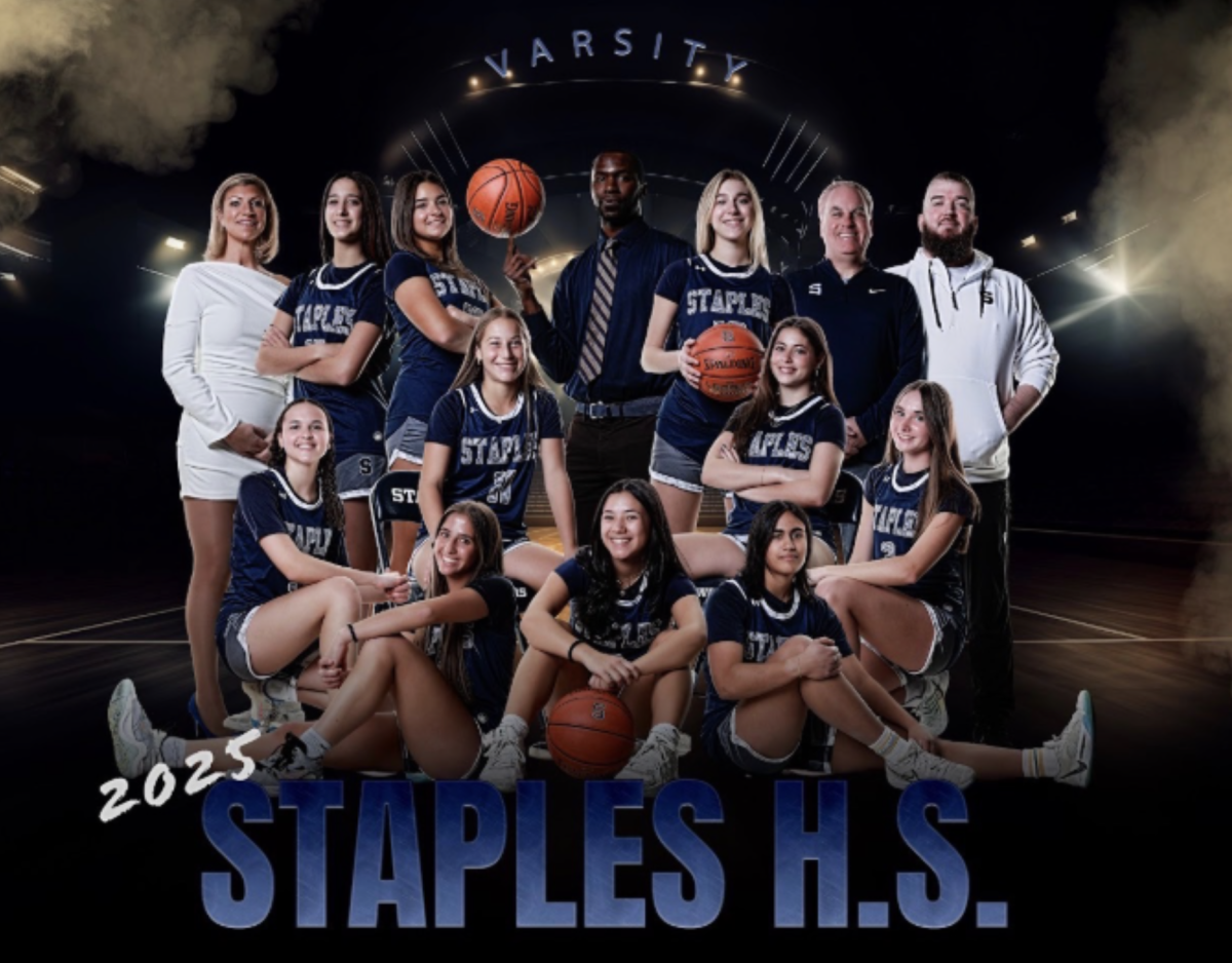 Staples Girls’ basketball varsity team poses together during media day ahead of the season.