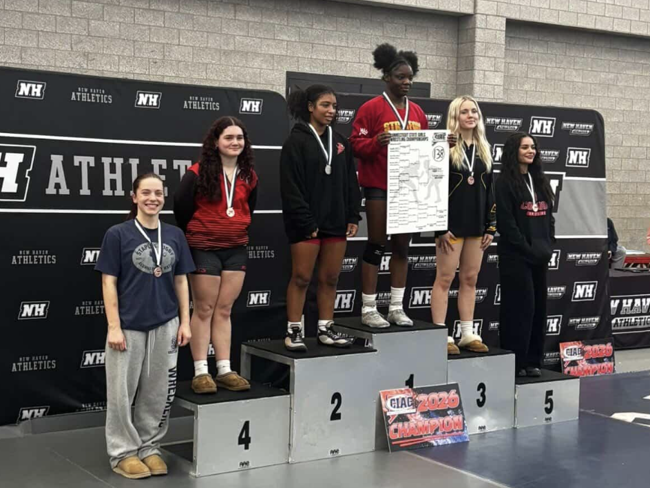 Pictured above is Amelia Guimond (far left) who broke
Wrecker history during the CIAC State Championship bracket
as the first ever female to place for the state quarterfinals. She placed 6th in the competitions. 