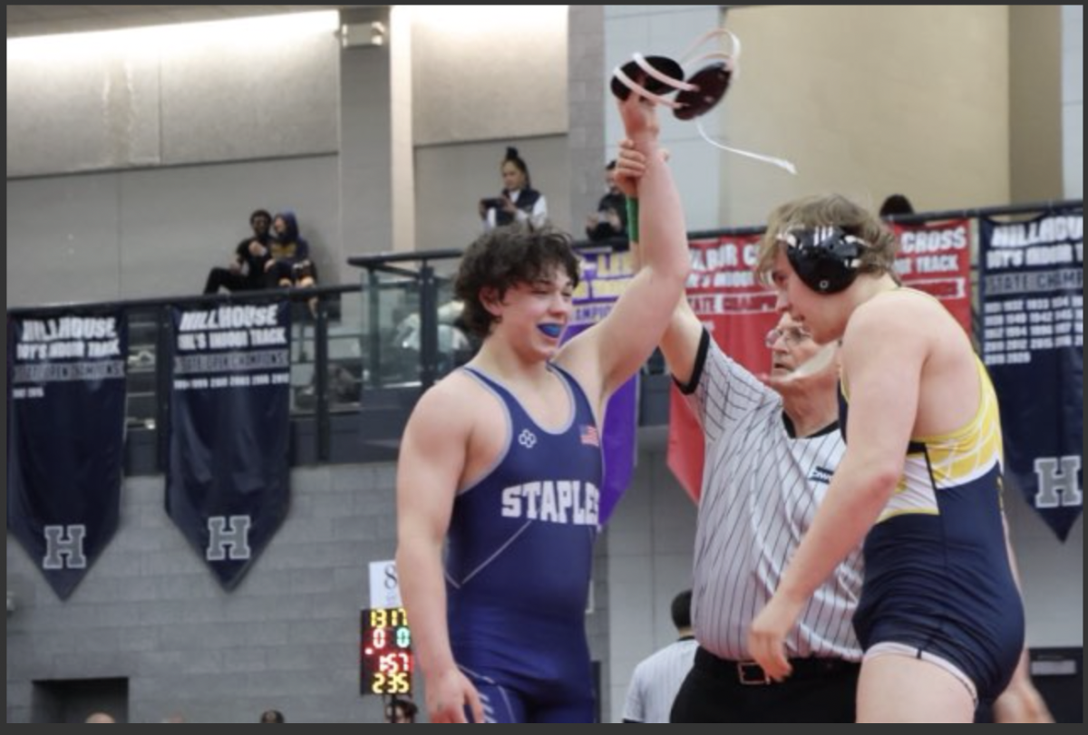 Julian Rousseau '28 secures a technical fall over a
Weston high school wrestler to advance to the finals. 
"This was a really easy match for me, to be honest," Rousseau said.