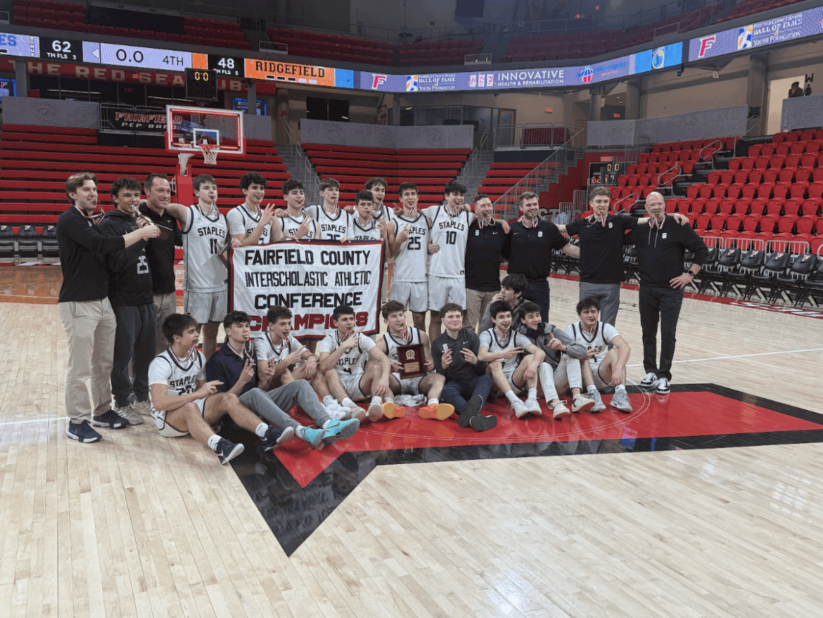 The Staples Wreckers celebrate their second straight FCIAC title at Fairfield University.
