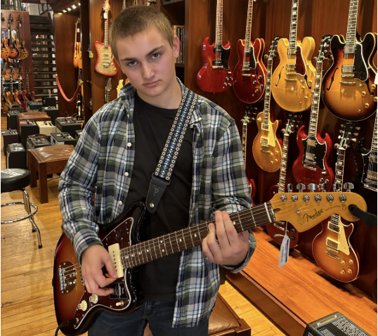 Nate Gerber is like a kid in a candy store, except his sweet tooth is for guitars.