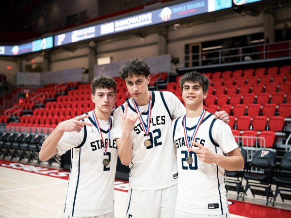 Ryan Marcus ’28, Henry Veissid ’28 and Declan Mayr ’28 (left to right) are three returning players that will step up to lead the boys’ basketball team next season. 
