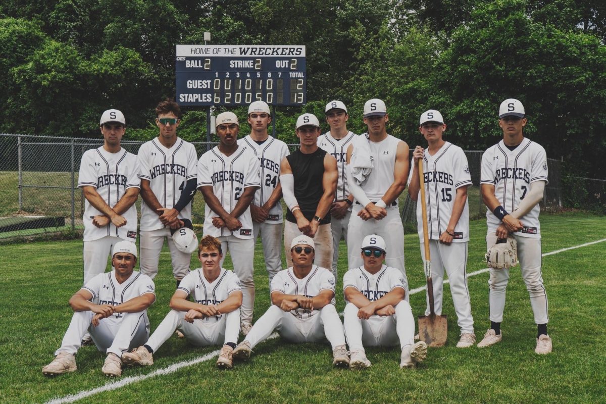 Staples Baseball celebrate after the quarterfinal win. 